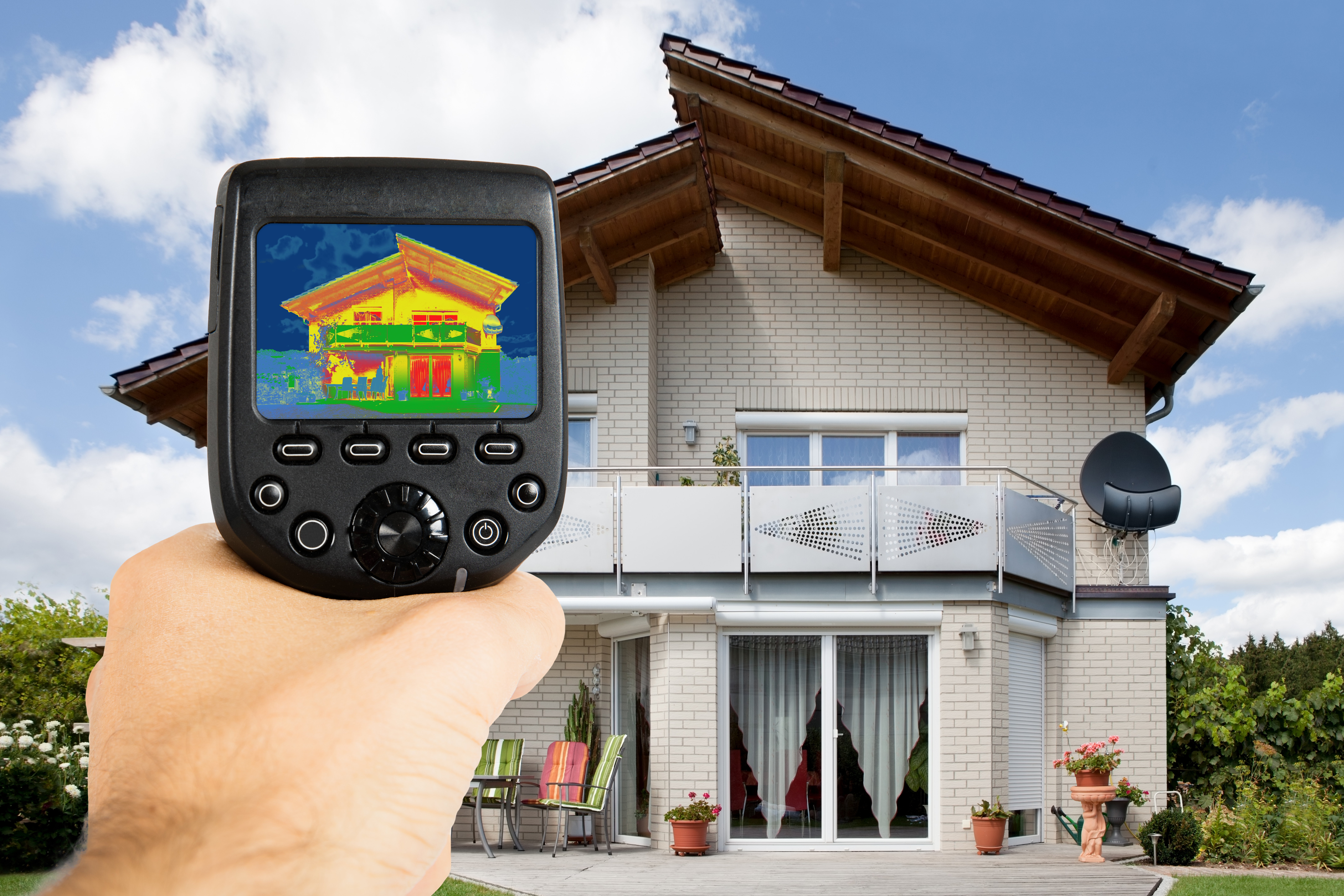 ein Haus w3elches mit einem Gerät gescannt wird