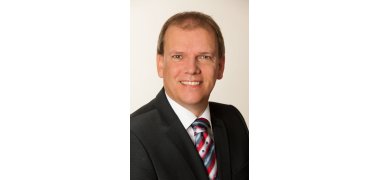 Ein Portrait von Bürgermeister a.D. Christoph Burkhard. 